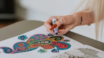 a person painting on a table